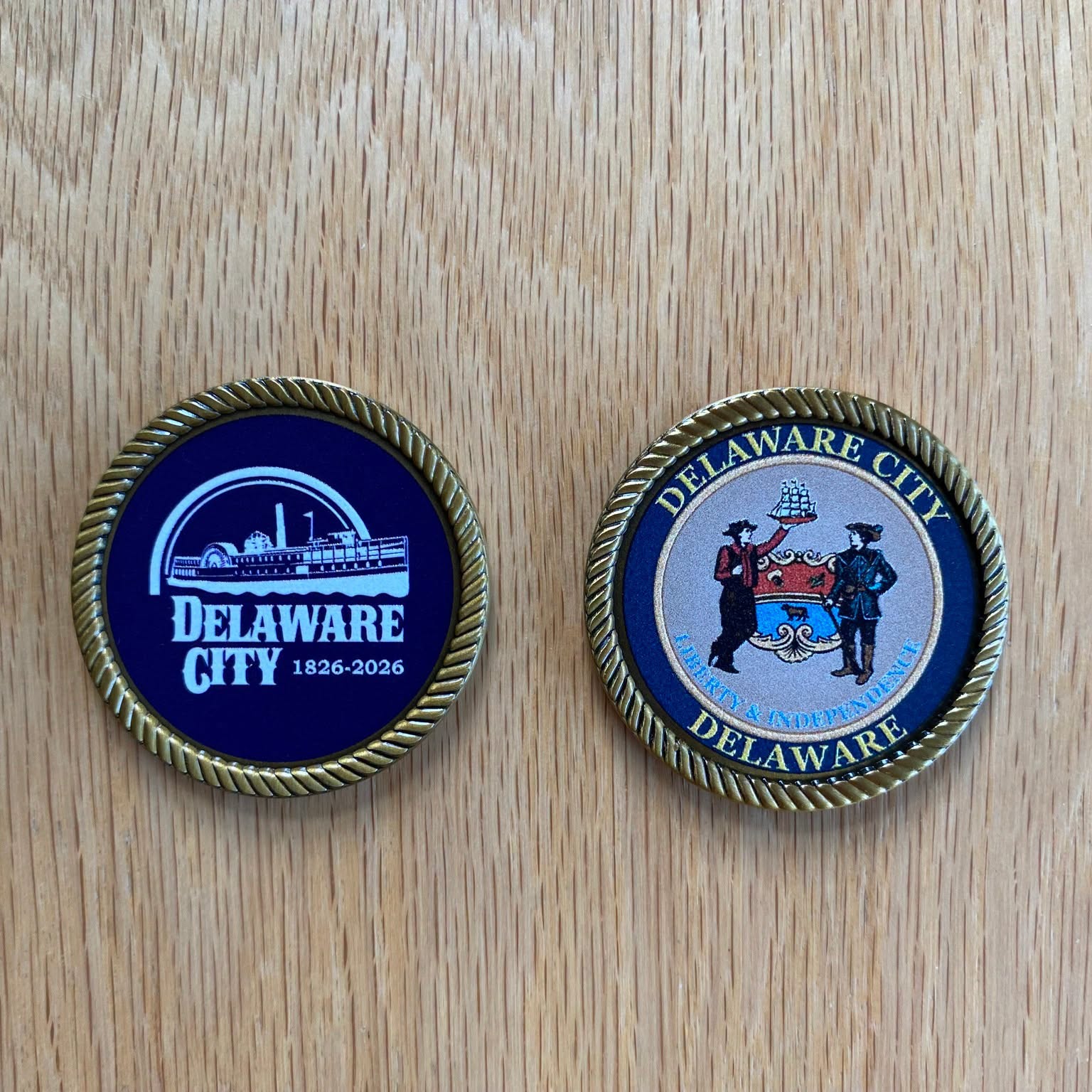Commemorative coins and patches marking 1826 to 2026