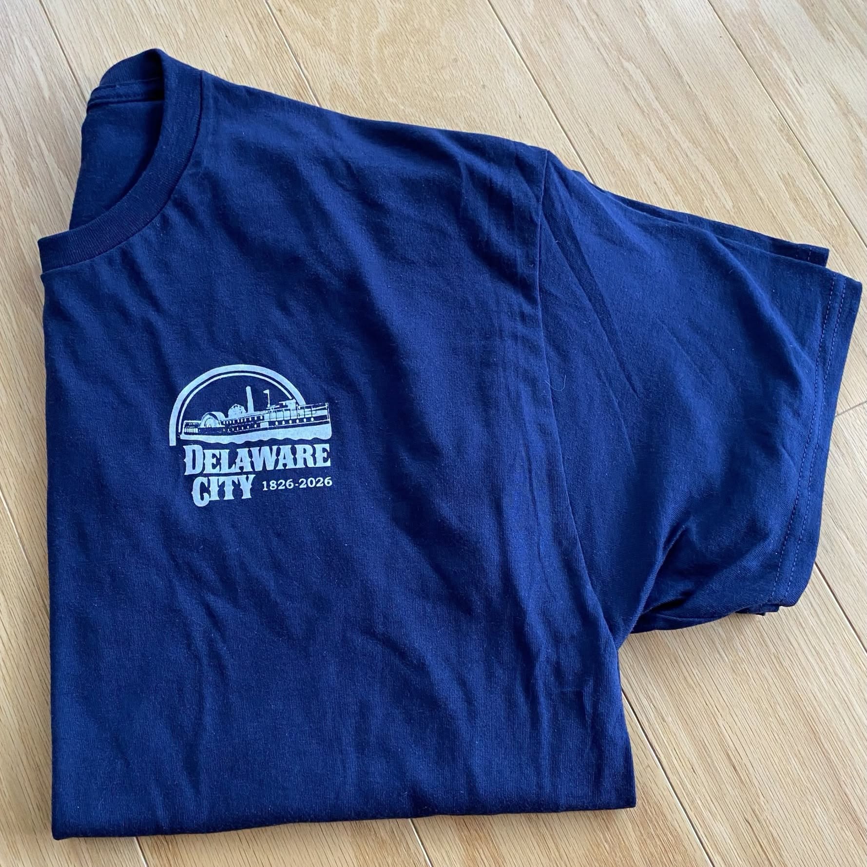 Royal blue Delaware City Day T-shirt printed for the 2026 celebration