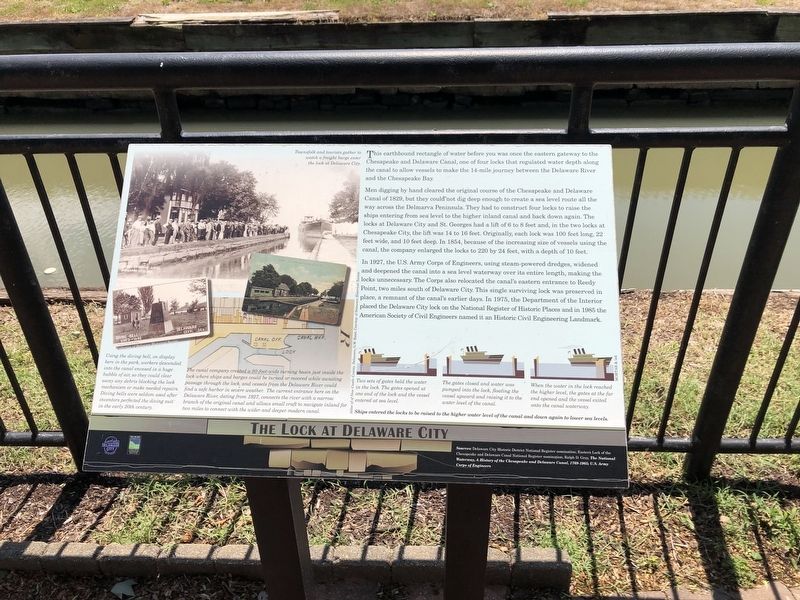 The Lock at Delaware City interpretive marker with historic canal illustrations and lock diagrams