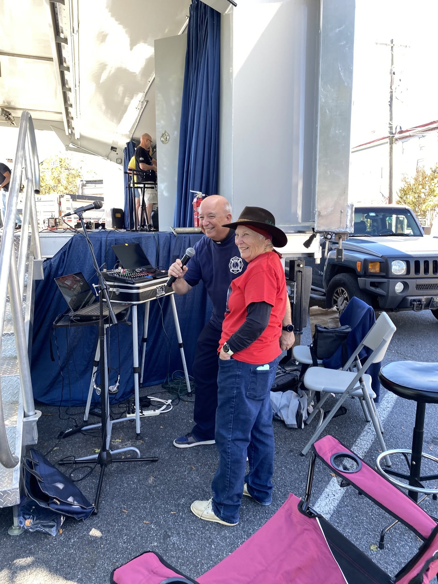 The announcer and a participant at the festival sound booth