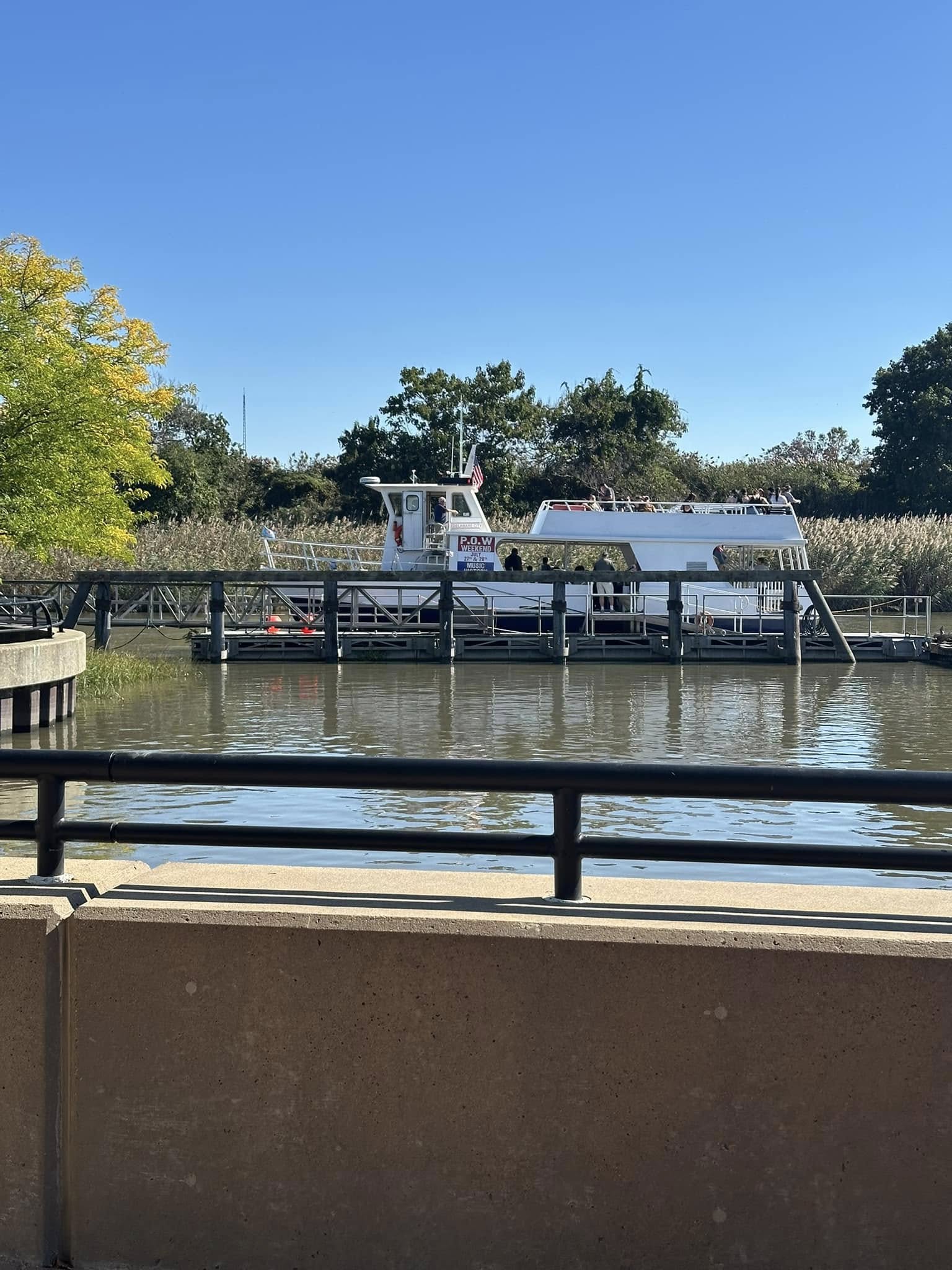 A tour boat docked along the canal in Delaware City