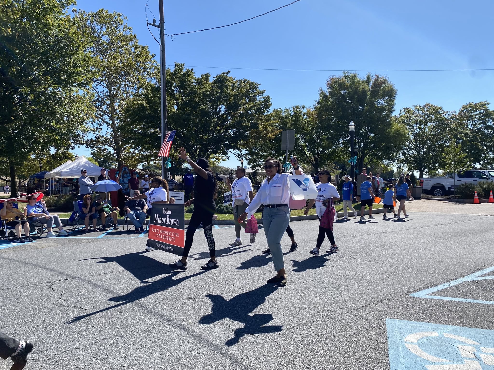 Parade participants marching along the route in Delaware City