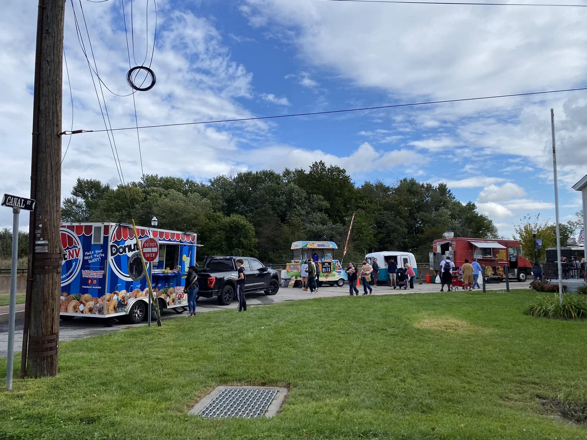 Food trucks lined up along the edge of the festival field
