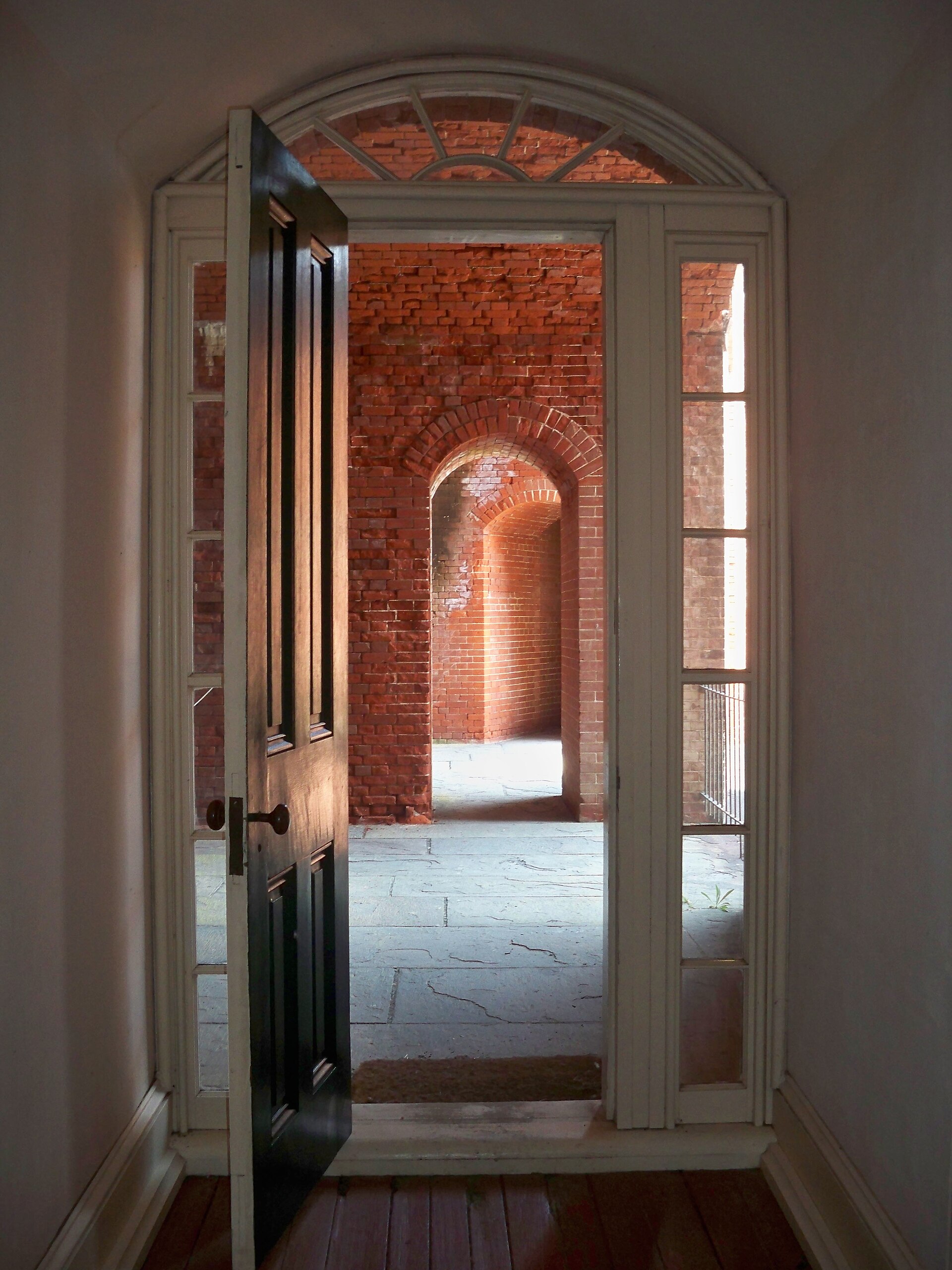 A view through doorways and brick arches inside Fort Delaware, photographed on Memorial Day 2012